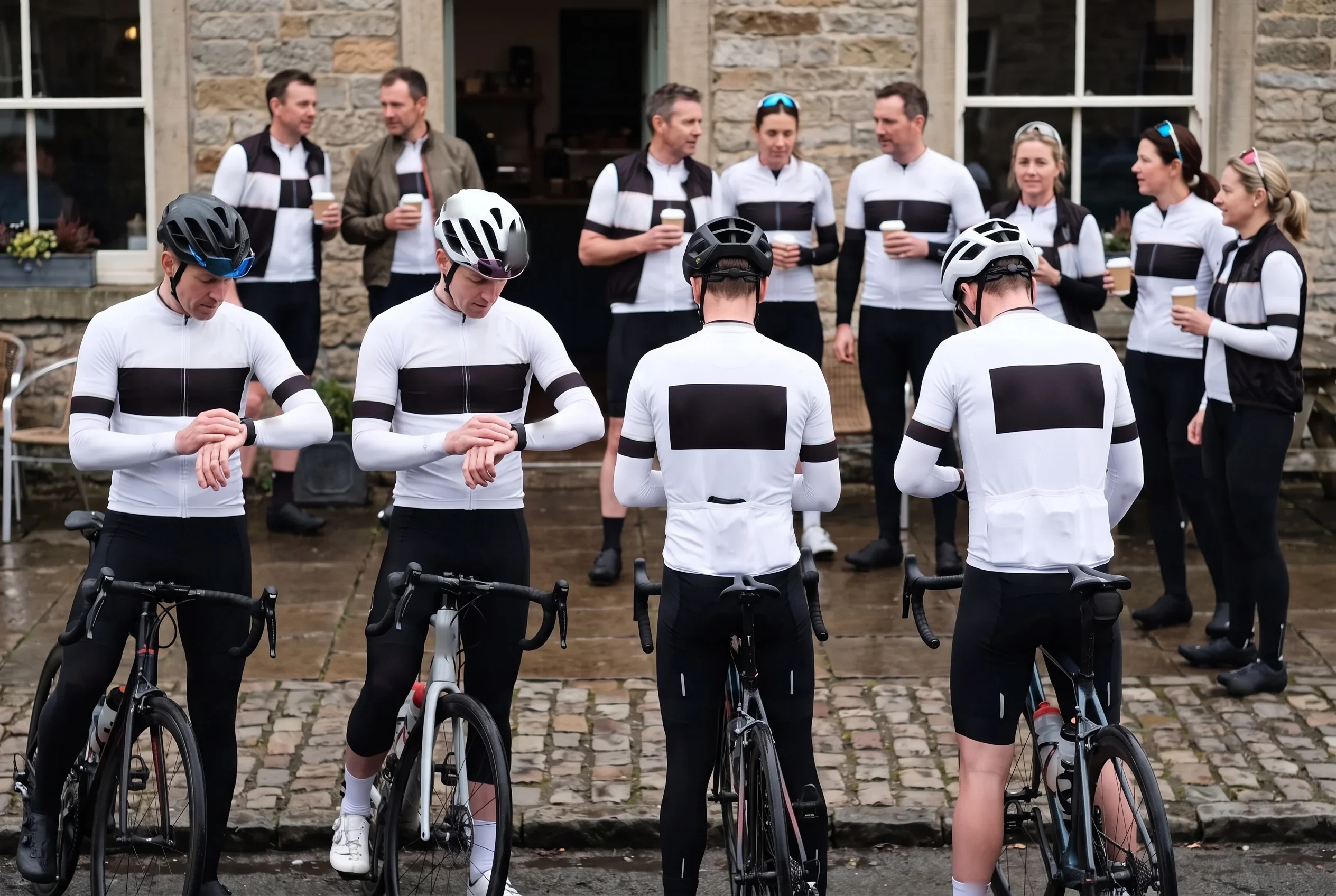 A team gathered in the same kit on race morning, every rider in the kit from their own labelled bag
